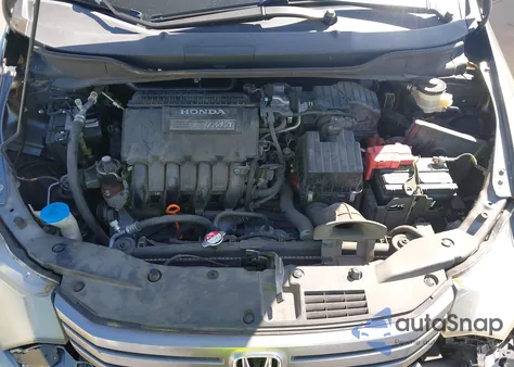 2011 Honda Insight from USA, damaged, VIN JHMZE2H32BS003362